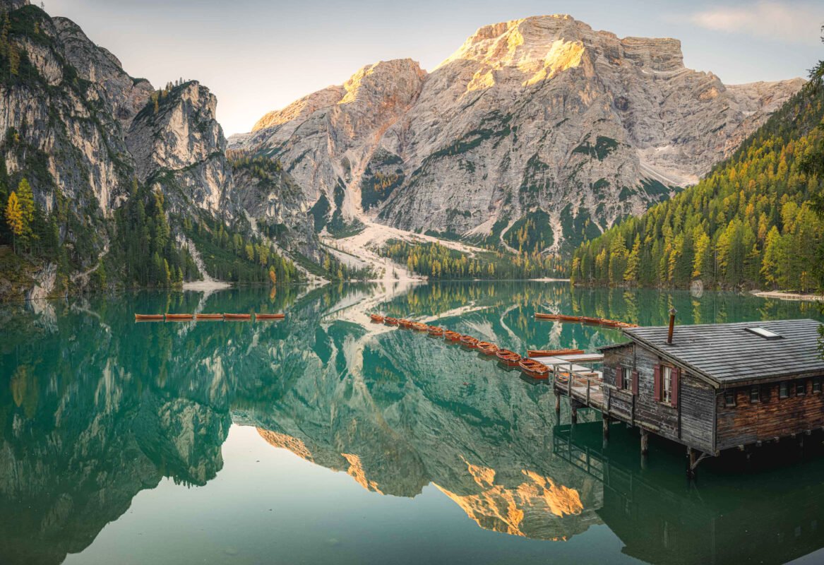 Sunrise Lago di Braies golden light mountain peaks Seekofel