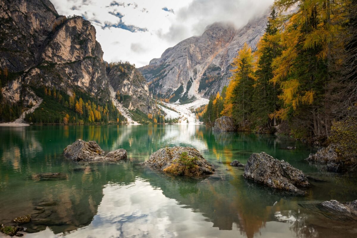 Lago di Braies turquoise water autumn Dolomites