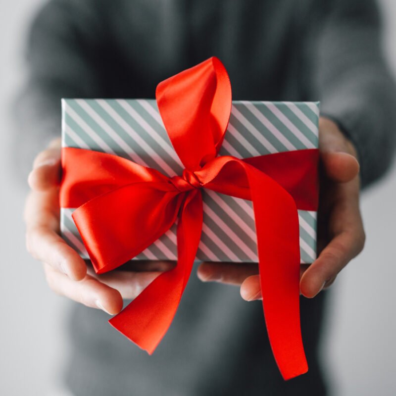 person giving a gift