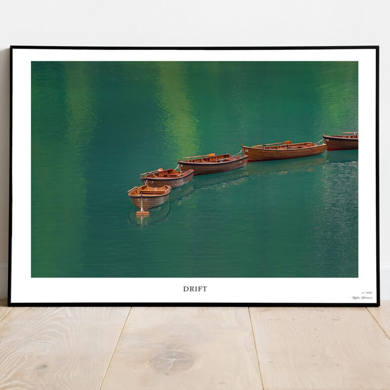 fine art print of rowing boats on emeral lake