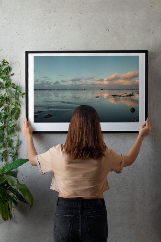 person hangin wall art