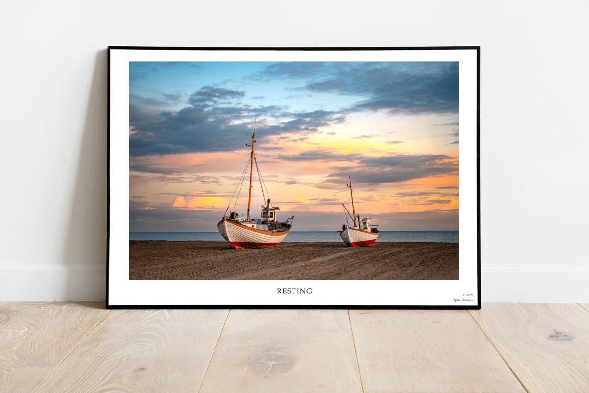 ine art print of fishing boats resting on Thorup Beach, Denmark at sunset.