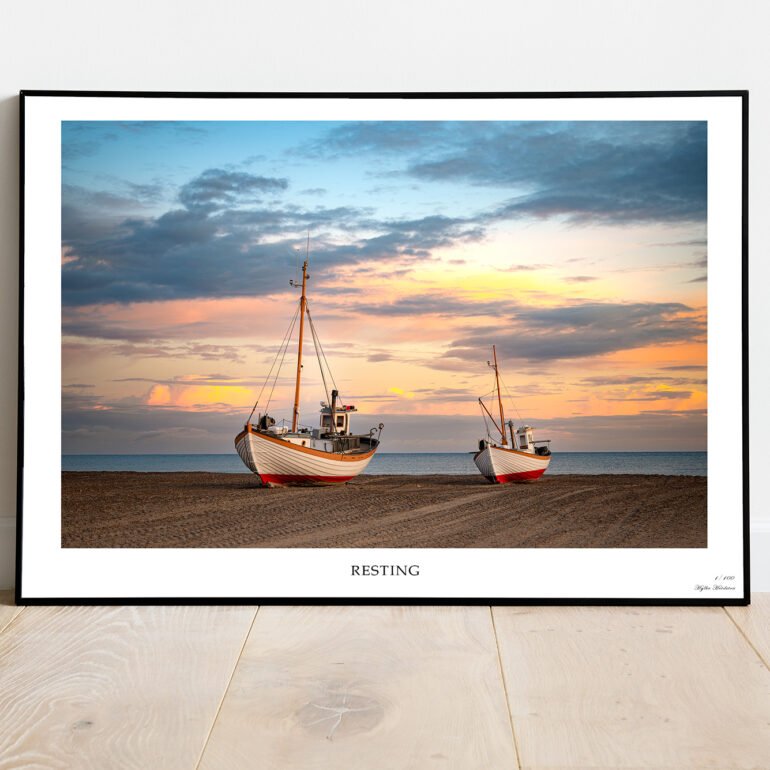 ine art print of fishing boats resting on Thorup Beach, Denmark at sunset.