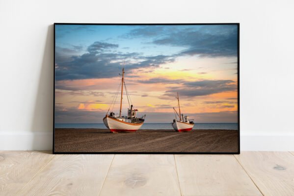 ine art print of fishing boats resting on Thorup Beach, Denmark at sunset.
