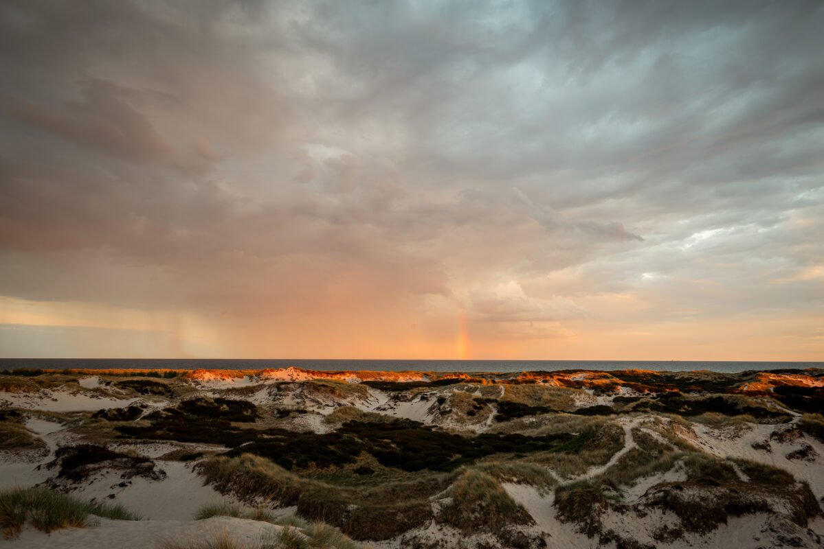 Approaching rainstorm Dueodde beach sunset