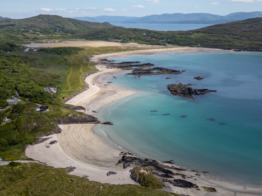 Aerial view of Derrynane Beach with white sand and crystal clear blue water