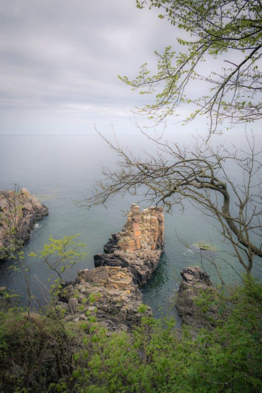 Vertical view of rocks and sea at Helligdomsklipperne