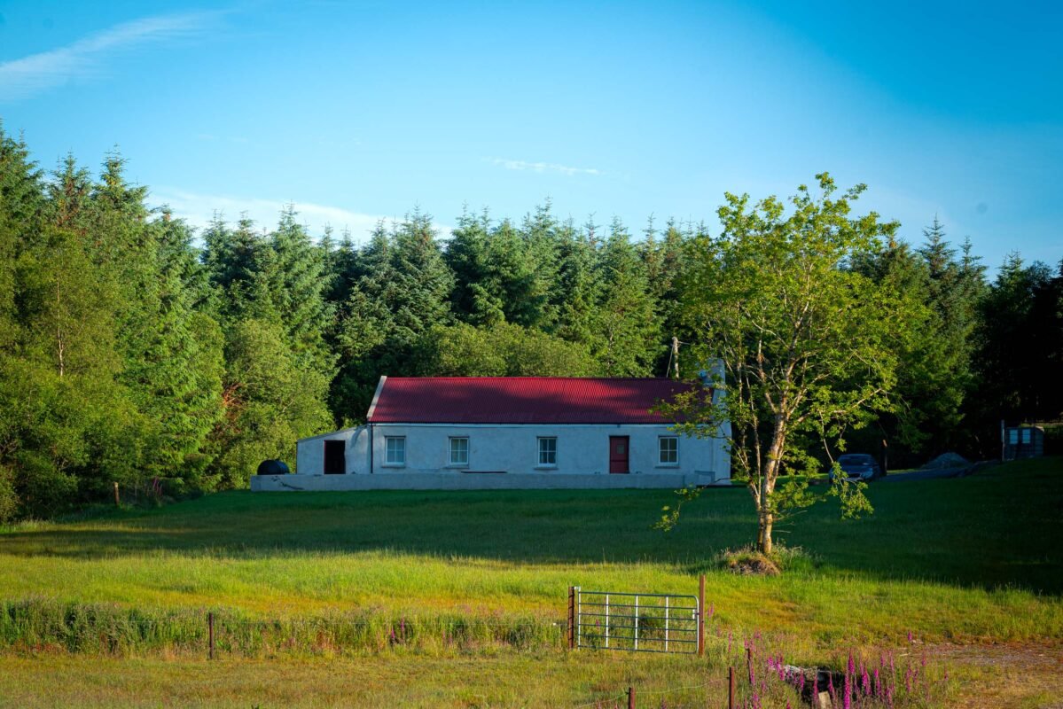 Typical Irish landscape with green hills and stone walls in County Kerry